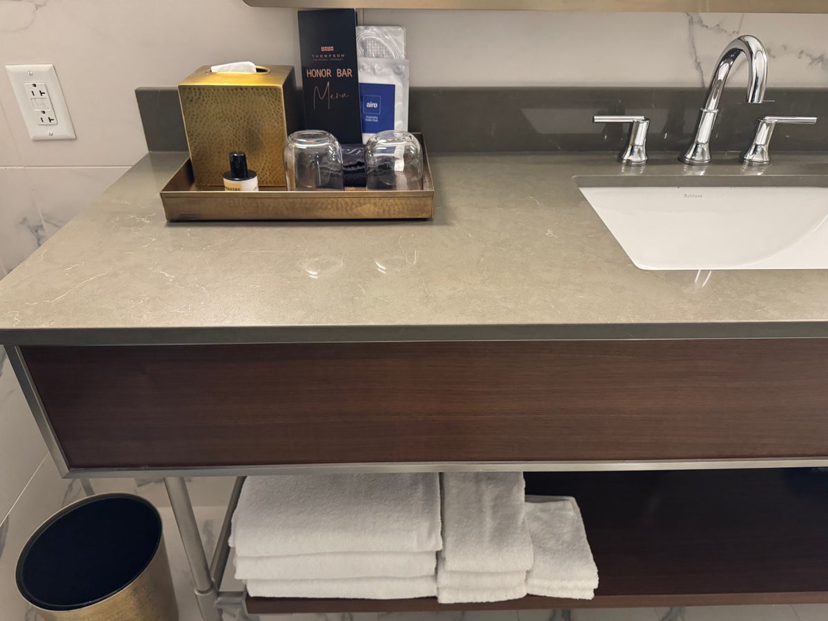 Thompson San Antonio Riverwalk bathroom counter with toiletries and towels