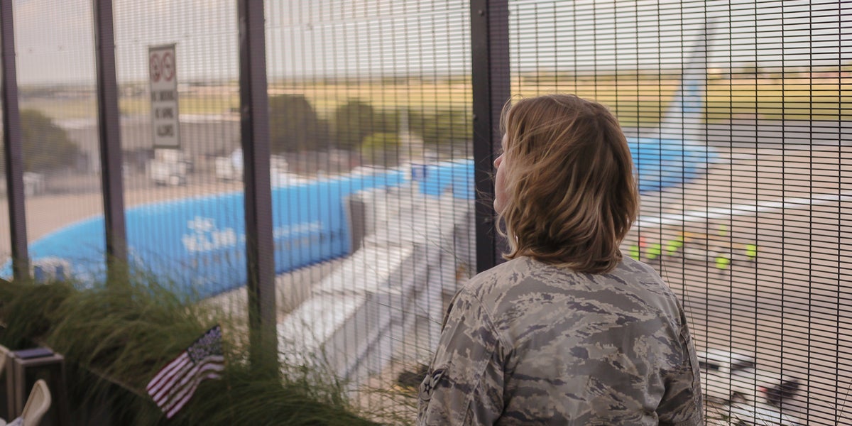 Military woman in airport on patio outside