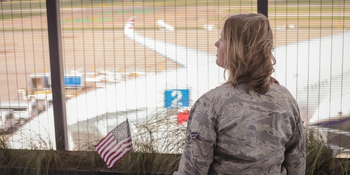 Military woman in airport on patio