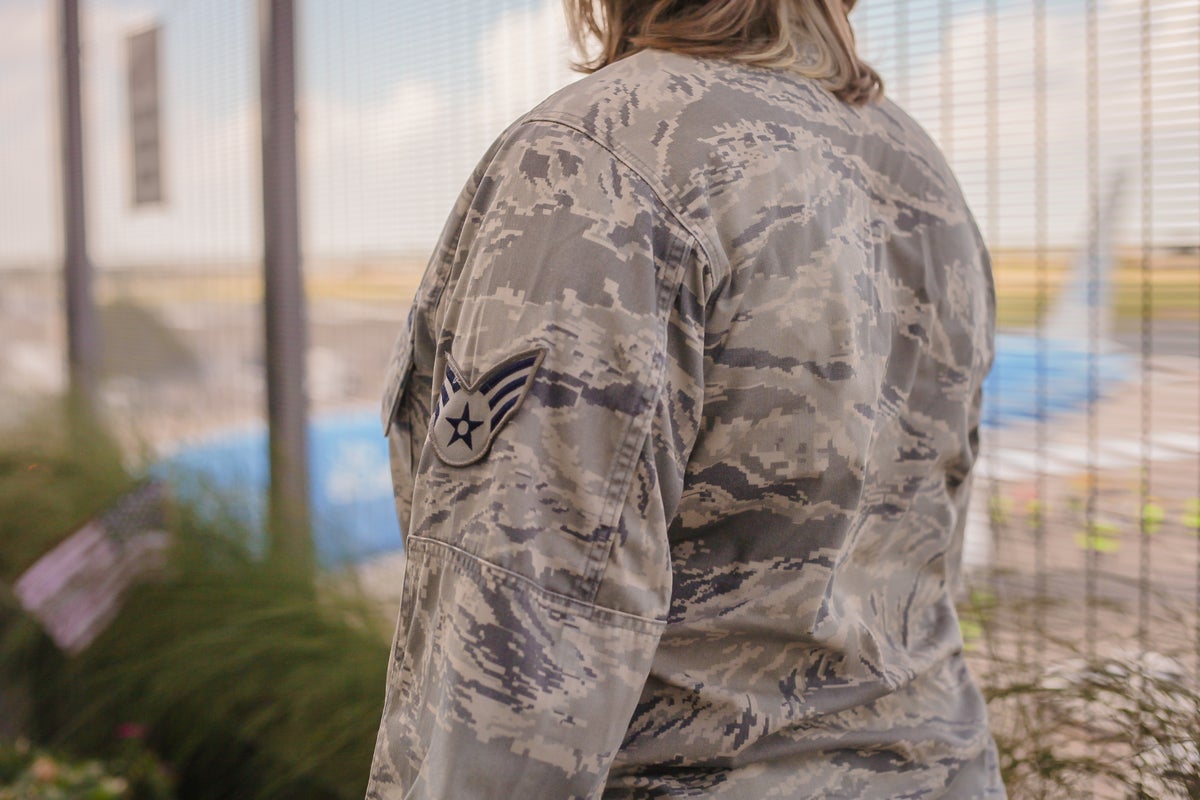 Military woman in airport sleeve closeup