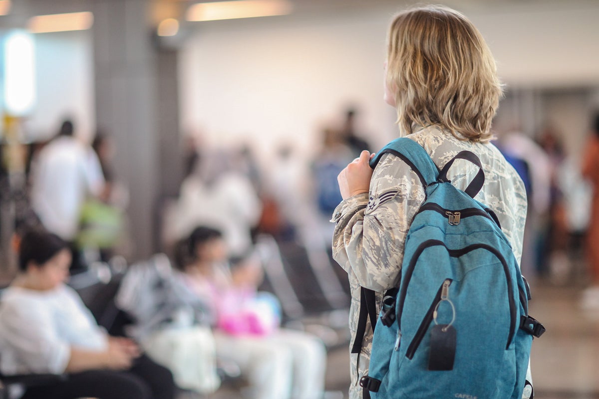 Military woman in airport waiting