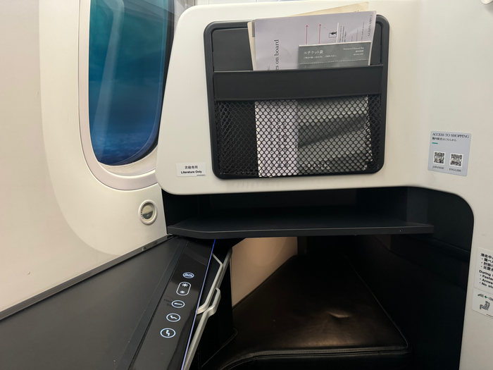 Zipair LAX NRT business class no screen footwell