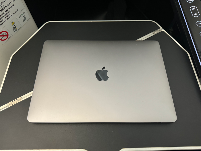 Zipair LAX NRT business class tray table with laptop