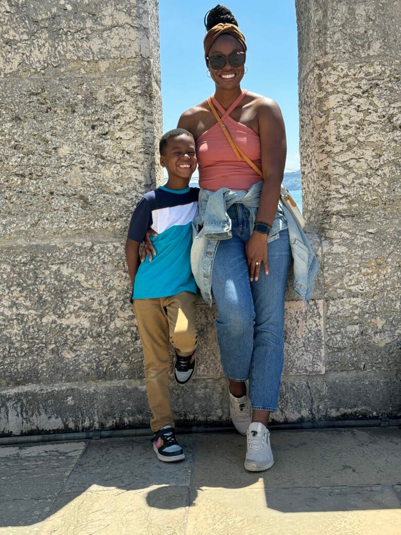Ashley and her son at Belem Tower in Lisbon, Portugal.