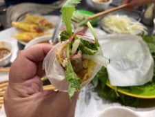 Bánh xèo (Vietnamese pancake) and nem lụi (pork skewers) in Da Nang, Vietnam.