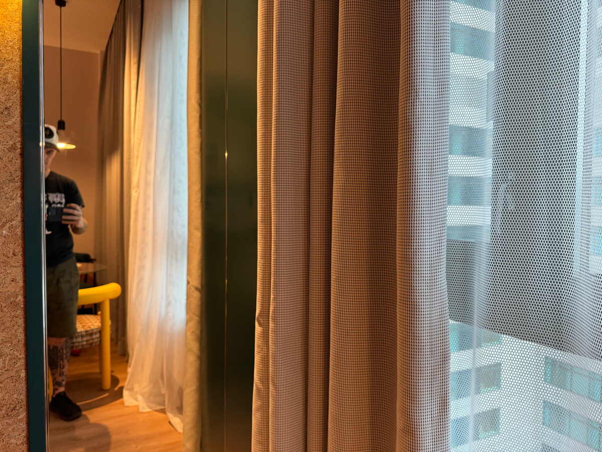 Caption by Hyatt Zhongshan Park Shanghai bedroom mirror curtains