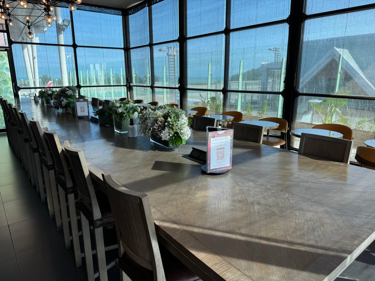 Coral Premium Departure Lounge HKT rear tables runway Coral Premium Departure Lounge HKT rear tables runway