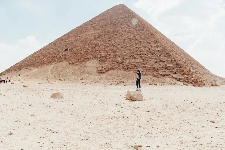 Standing at the base of one of Egypt's great pyramids.