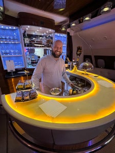 Enjoyed a refreshing shower and the convenience of an onboard bar at 38,000 feet in the air while flying first class with Emirates.