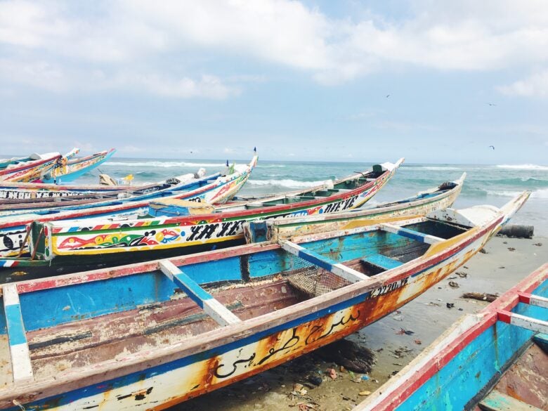 Fishing boats rest on the beach in Dakar, Senegal.
