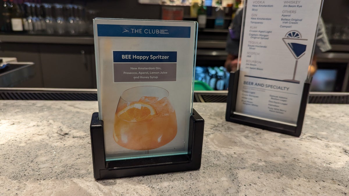 PIT The Club lounge food and beverage signature drink at the bar