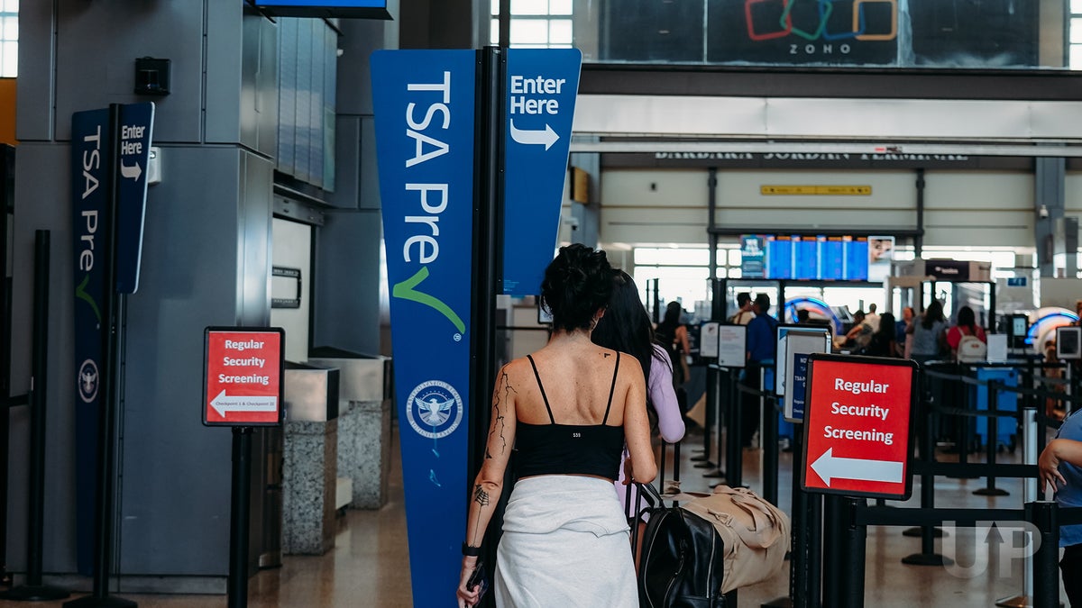 Passenger Joining TSA Precheck LineUpgraded Points LLC 2