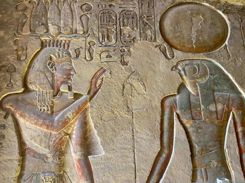 Hieroglyphics on the wall in a tomb at Valley of the Kings in Luxor, Egypt.