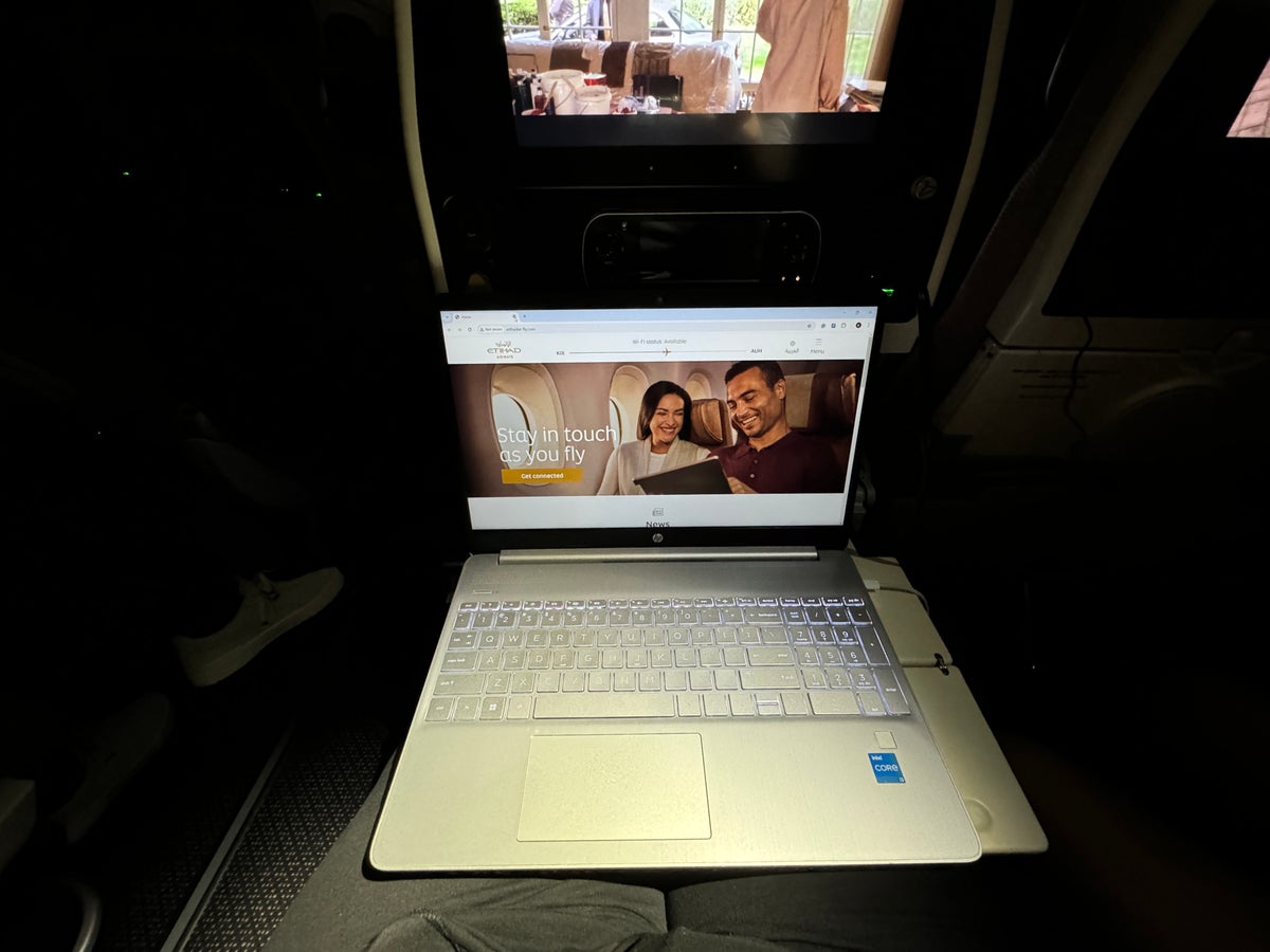 Etihad B787 9 Economy KIX AUH laptop on tray table