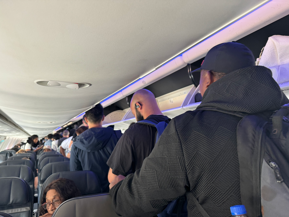 Alaska Airlines B737 9 MAX LAX BZE passengers in aisle