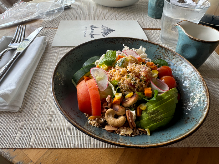 Matachica Resort Belize Mr Mrs Smith restaurant salad on table Matachica Resort Belize Mr Mrs Smith restaurant salad on table