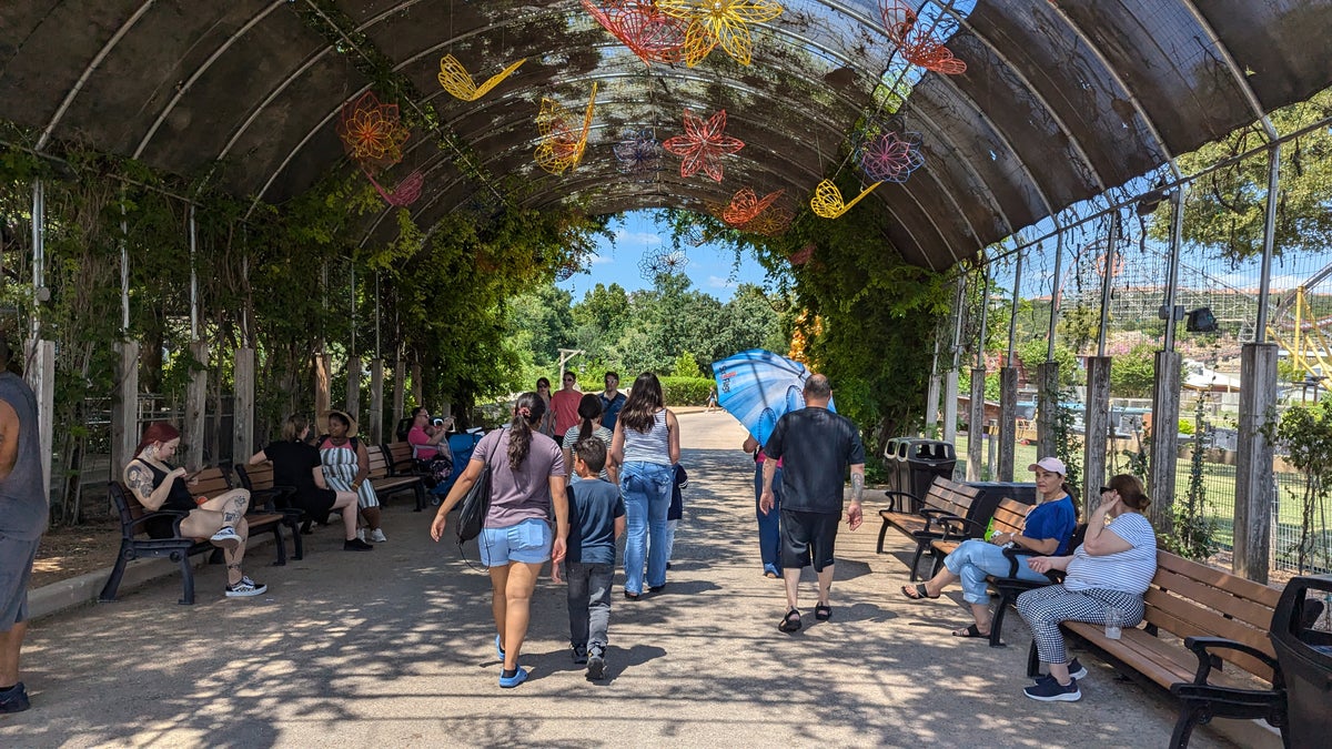 Shaded walkway and benches at Six Flags Fiesta Texas