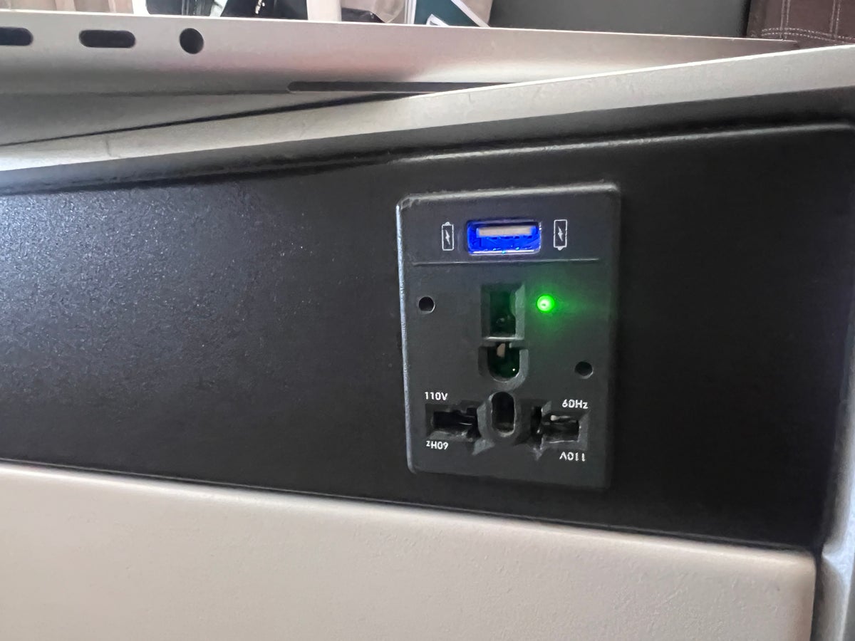 Swiss 777 business class seat AC power outlet