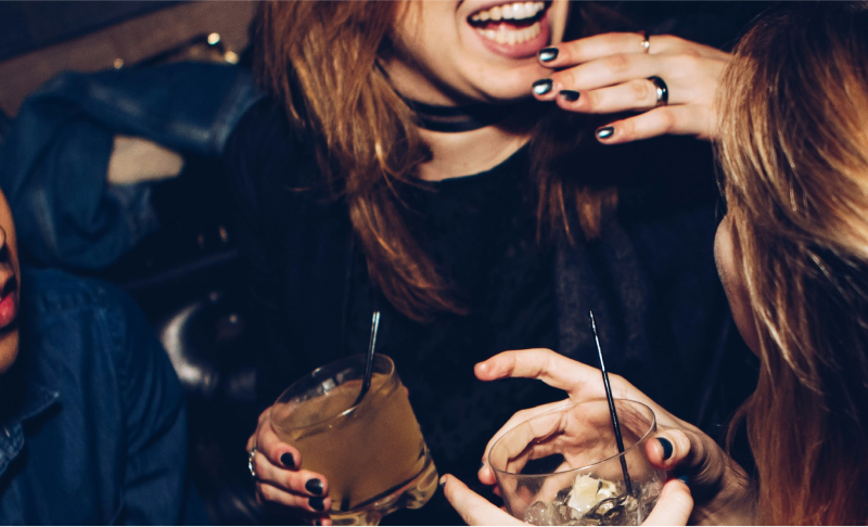 Women laughing with drinks