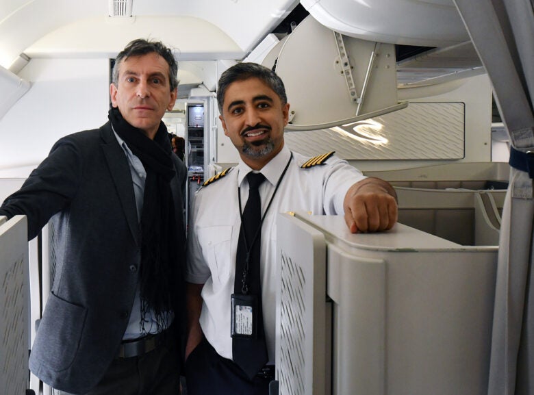 Alberto with an airline captain in first class