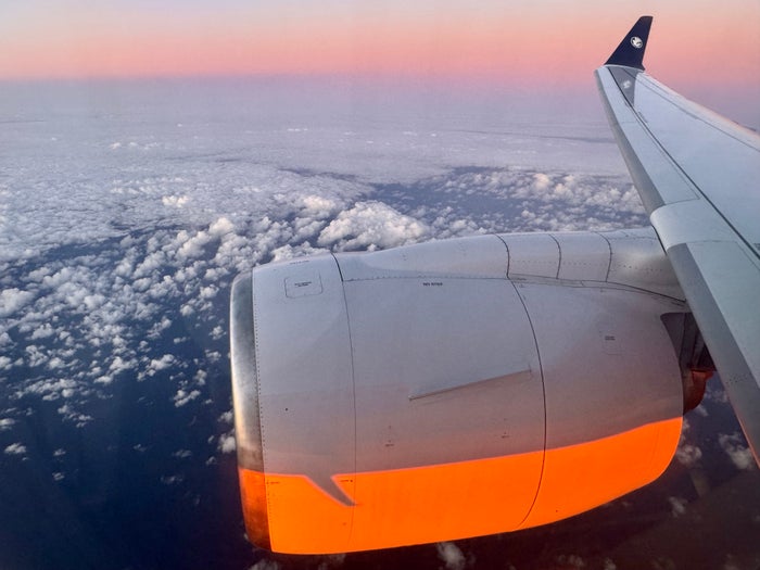 Air France Airbus A220 economy sunrise wing view