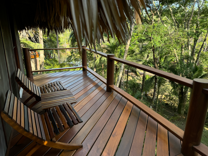 Blancaneaux Lodge Belize Mr Mrs Smith cabana balcony chairs Blancaneaux Lodge Belize Mr Mrs Smith cabana balcony chairs