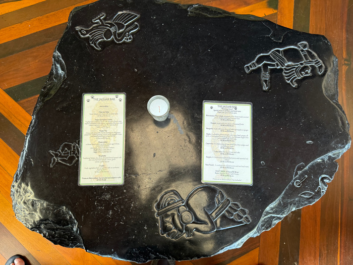 Blancaneaux Lodge Jaguar Bar table with menus Blancaneaux Lodge Jaguar Bar table with menus