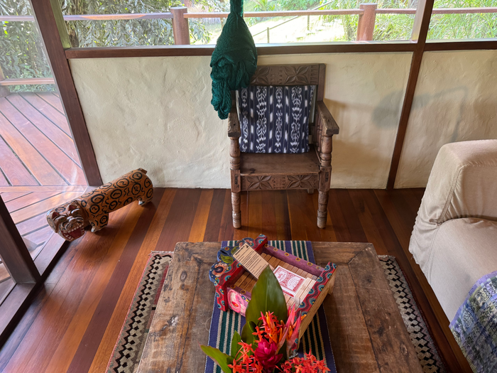 Blancaneaux Lodge seating area in cabana Blancaneaux Lodge seating area in cabana