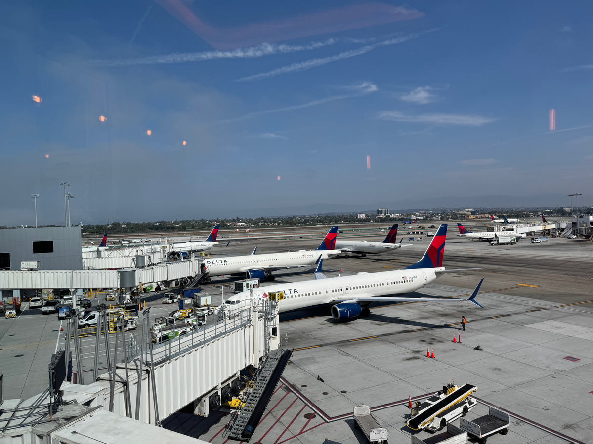 Delta planes parked at LAX gates view from Delta One Lounge