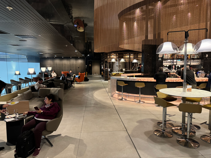 LATAM Lounge Santiago SCL sitting area next to main bar LATAM Lounge Santiago SCL sitting area next to main bar