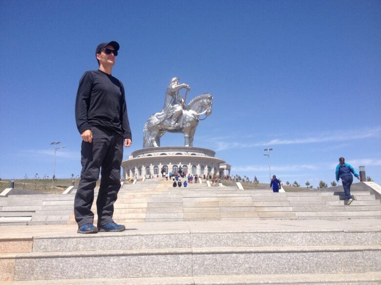 Ryan Smith in Mongolia in front of Genghis Khan statue