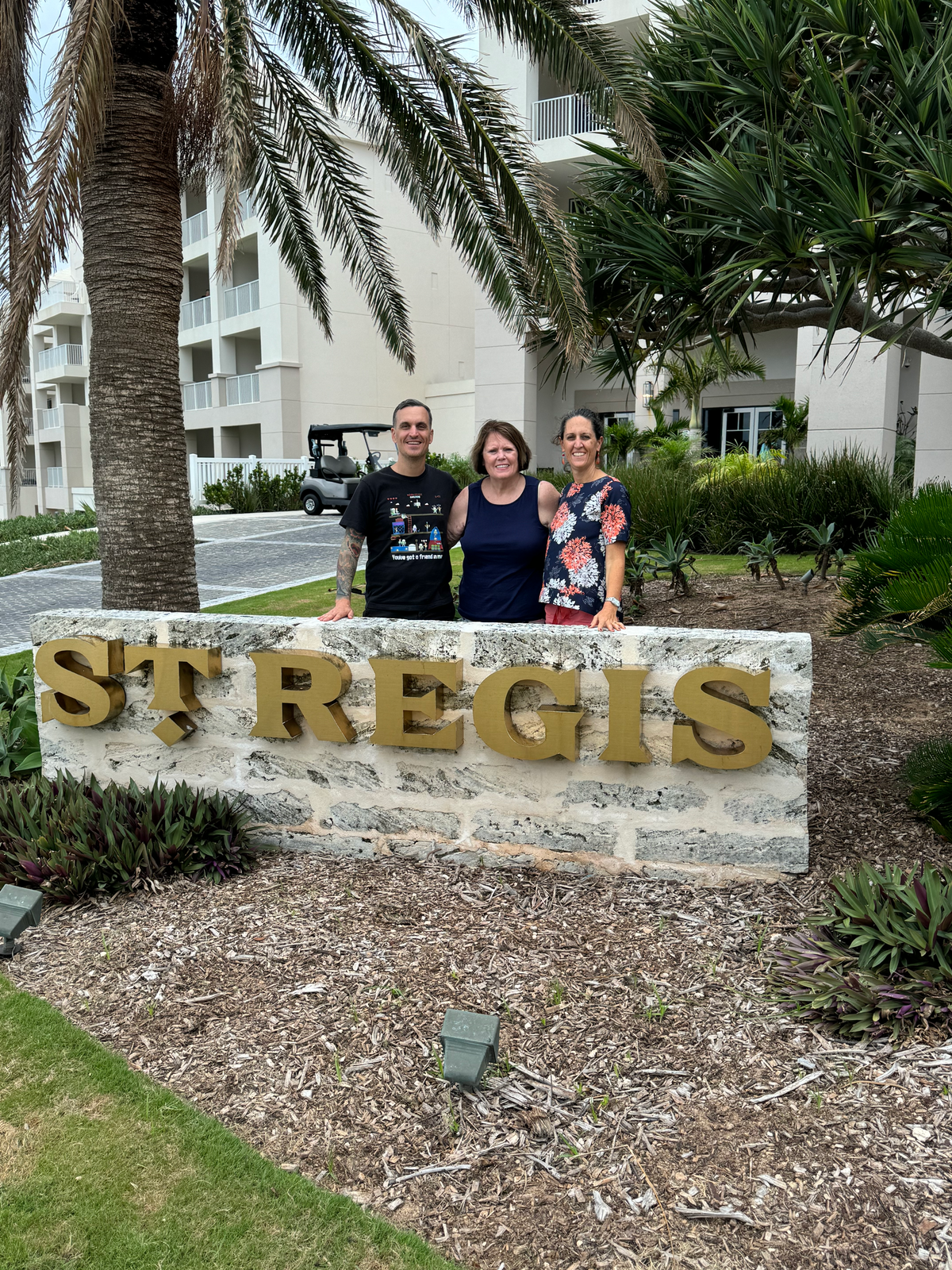 St Regis Bermuda family with sign