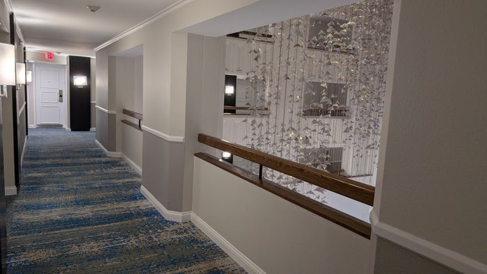 Hilton Buena Vista Palace Orlando guestroom hallway overlook Hilton Buena Vista Palace Orlando guestroom hallway overlook