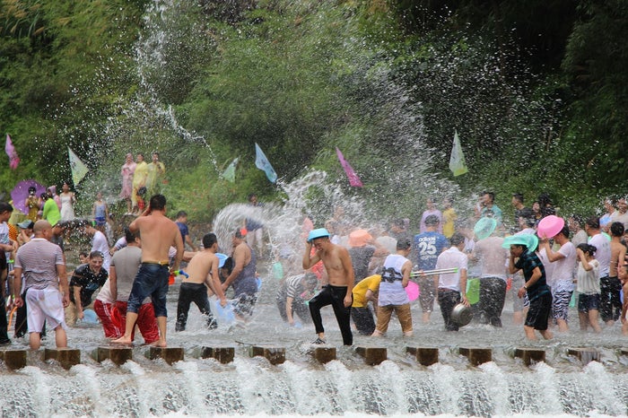 Songkran Water Fight People spraying water at each other