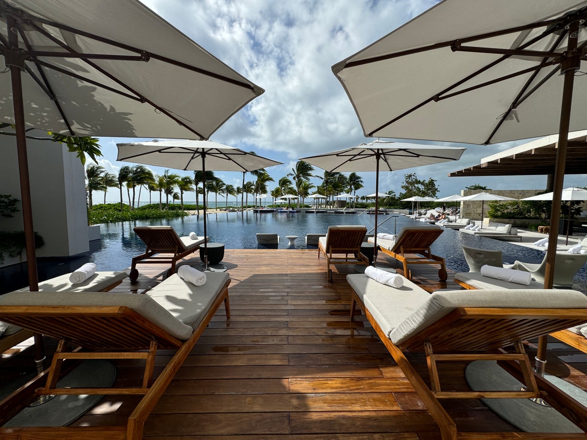 St. Regis Kanai pool loungers and umbrellas