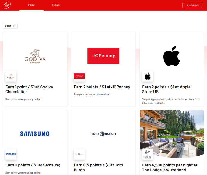 Smiley woman shopping online with laptop credit card Virgin Red earn points