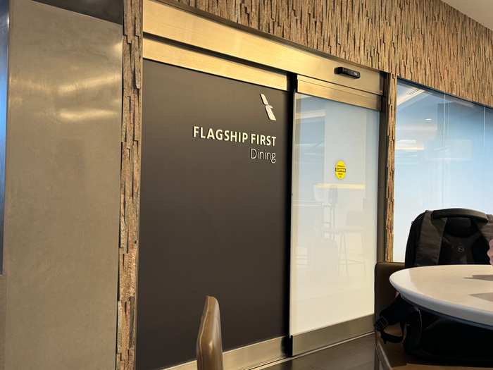 AA Flagship Lounge MIA Flagship First dining sign AA Flagship Lounge MIA Flagship First dining sign