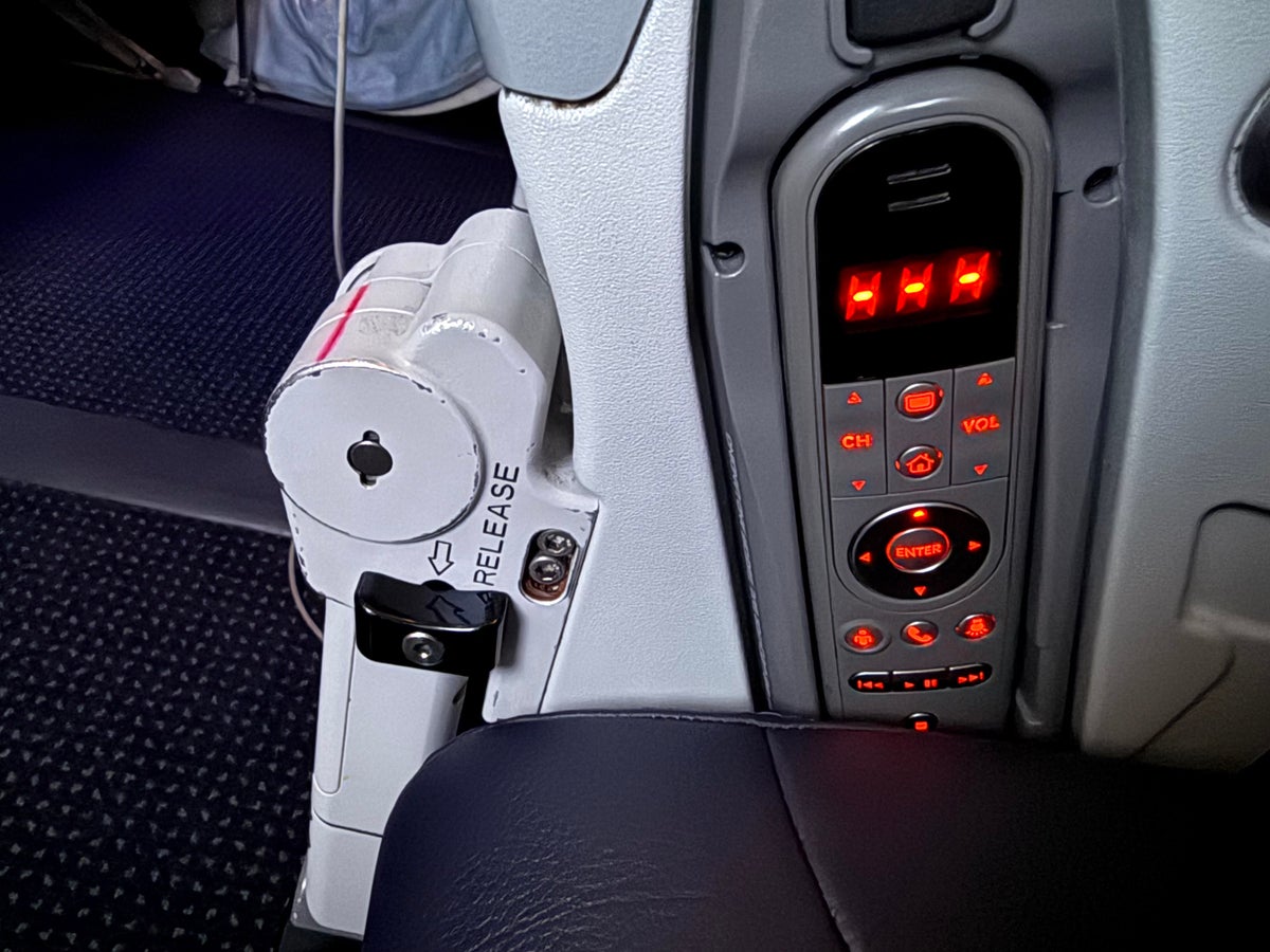 American Airlines economy IFE release bulkhead