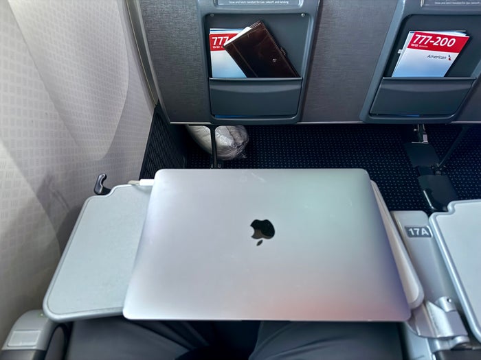 American Airlines economy laptop on tray table