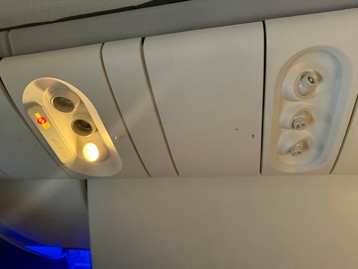 American Airlines economy lights and air vents