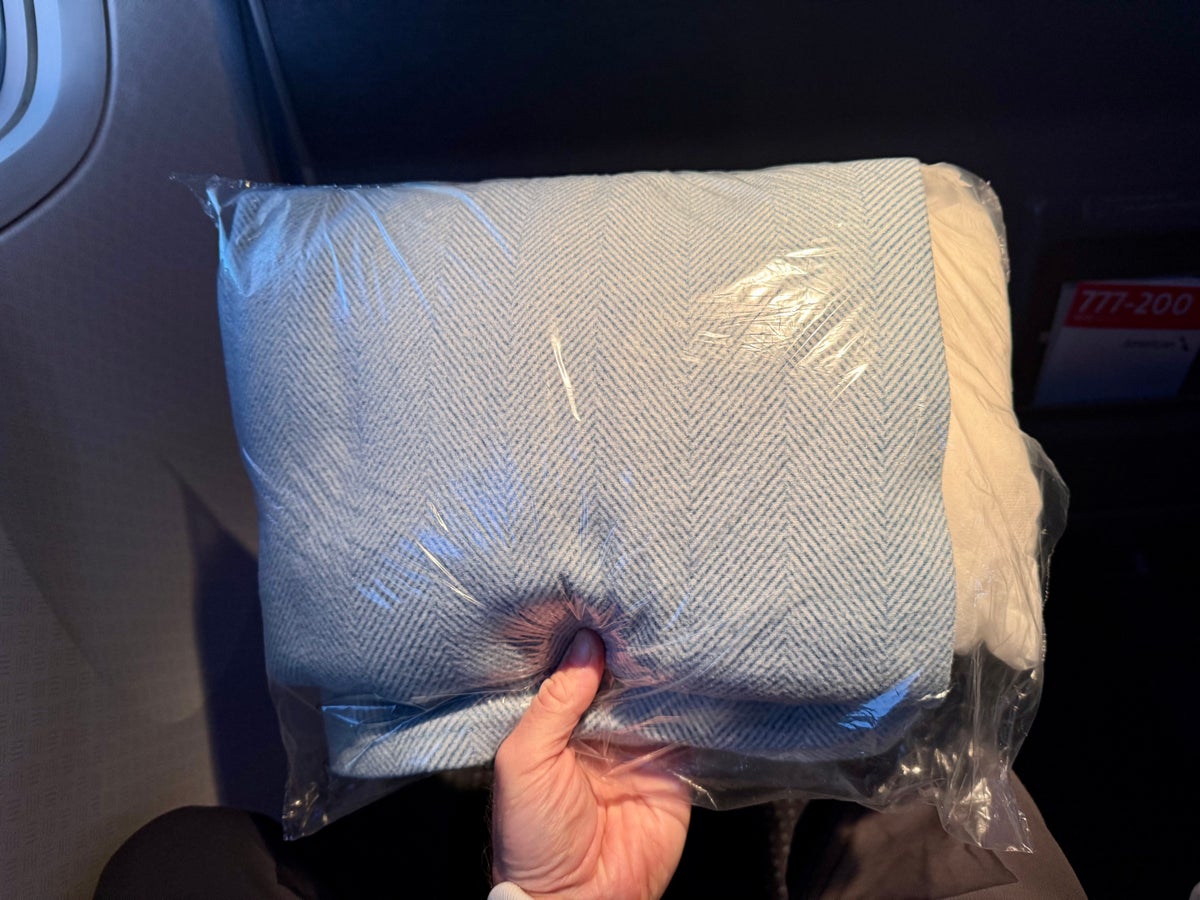 American Airlines economy pillow and blanket in plastic