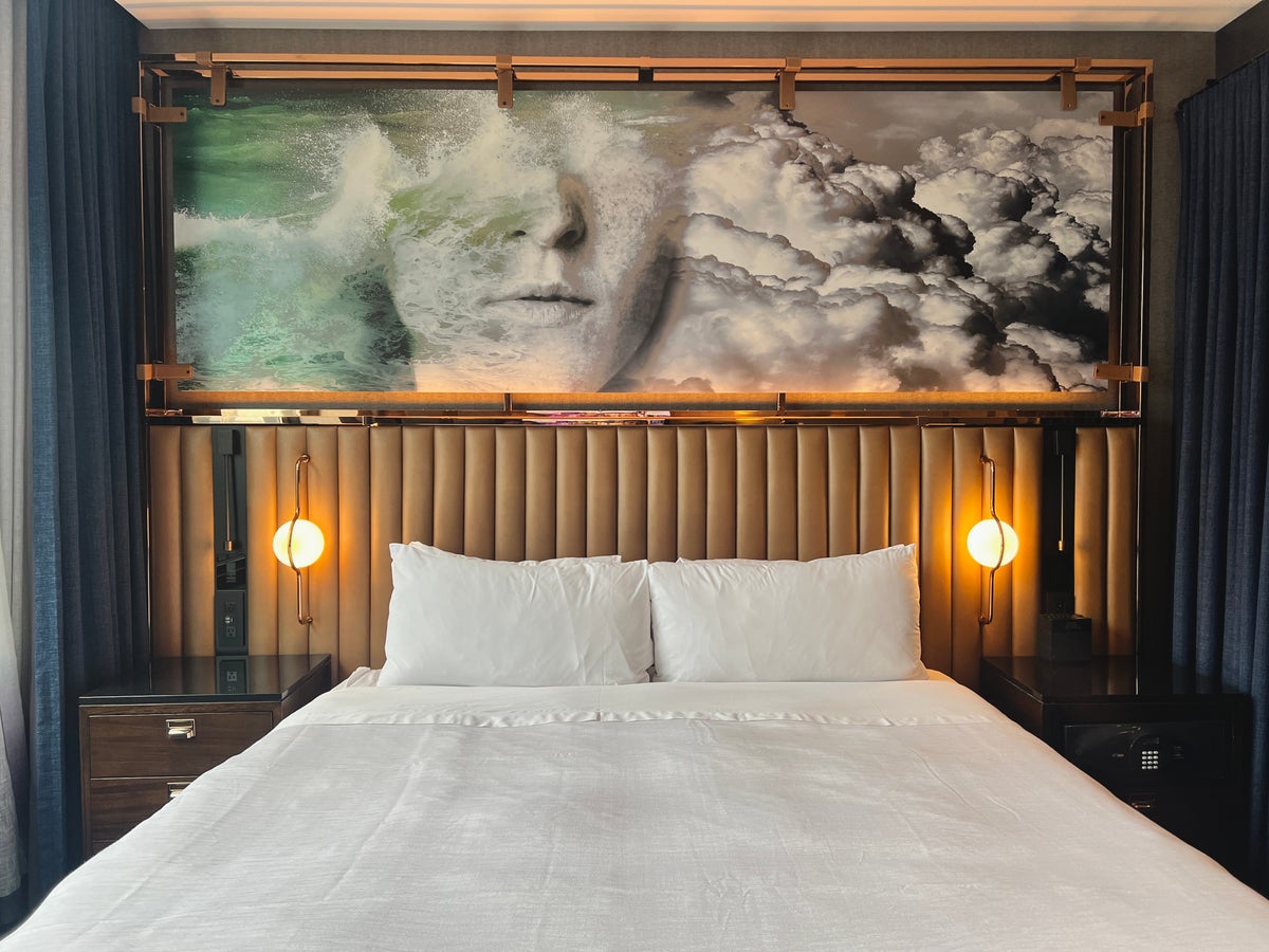 Hotel EMC2 Autograph Collection room bed headboard and art