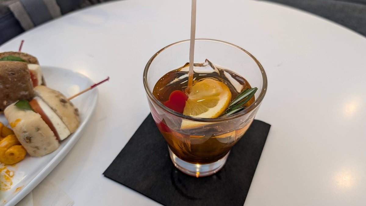 The Club MCO Terminal A food and beverage bar specialty drink old fashioned