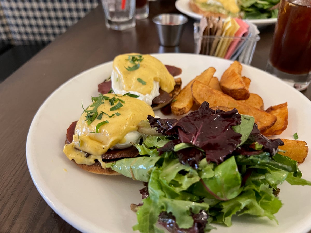 Eggs benedict on a white plate