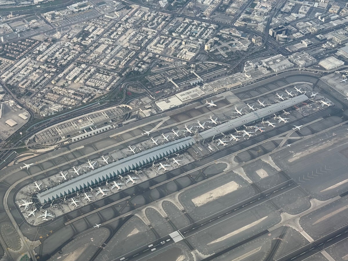 Emirates Airbus A350 flying over Dubai Airport DXB