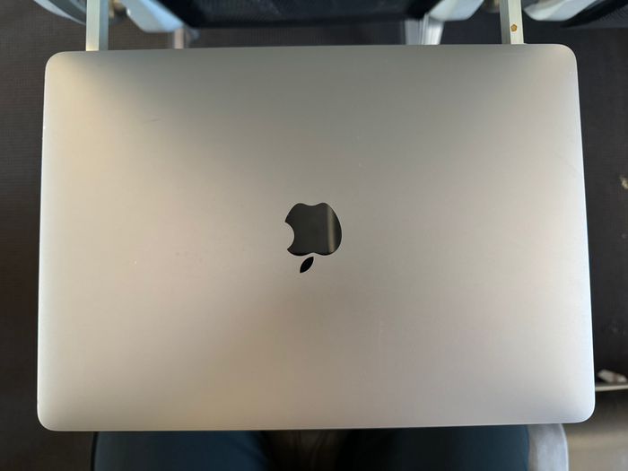 JetSmart A320 laptop on tray table JetSmart A320 laptop on tray table