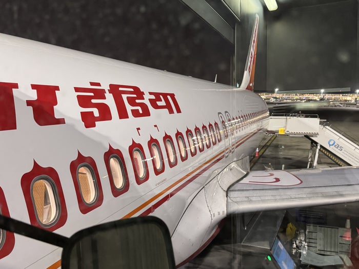 Air India A320 Economy DOH BOM plane from jet bridge