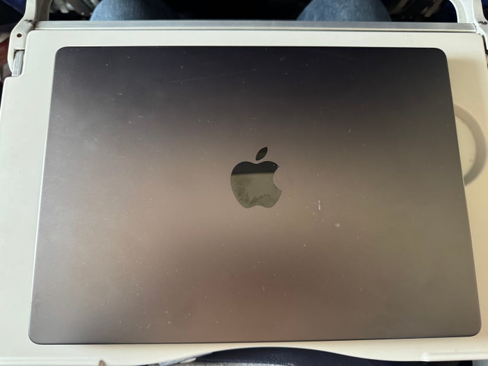 Avelo Airlines B737 7 laptop on tray table Avelo Airlines B737 7 laptop on tray table