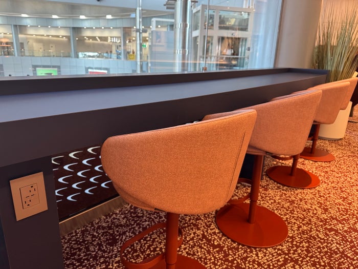 Capital One Lounge Las Vegas chairs near window Capital One Lounge Las Vegas chairs near window