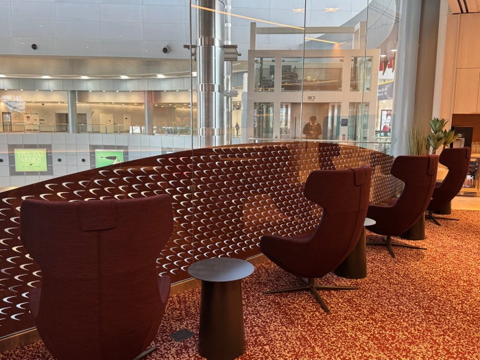 Capital One Lounge Las Vegas recliners near glass Capital One Lounge Las Vegas recliners near glass